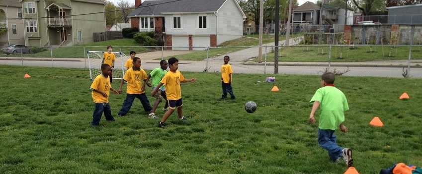 Assisting Community Transformation Kids Playing Soccer BRKC
