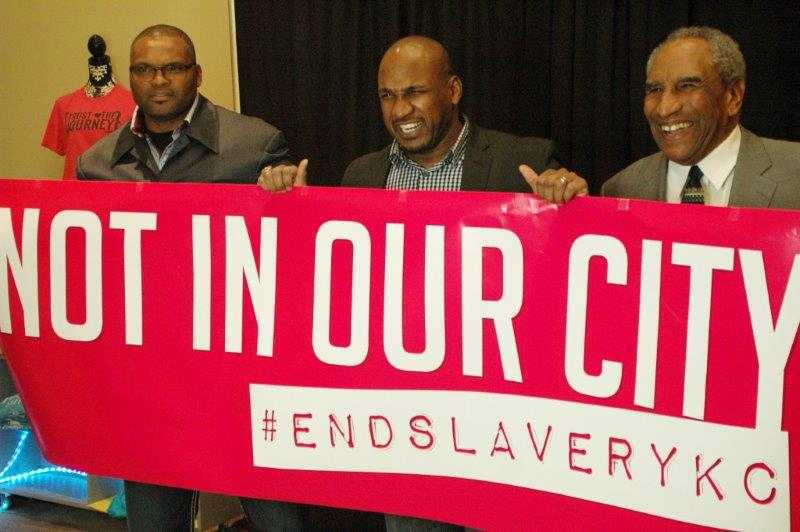 Kansas City Chiefs players hold Not in Our City Banner